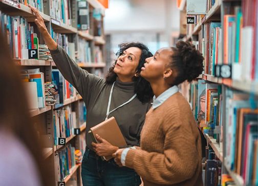 Women in library choosing books