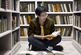 Young man on floor reading