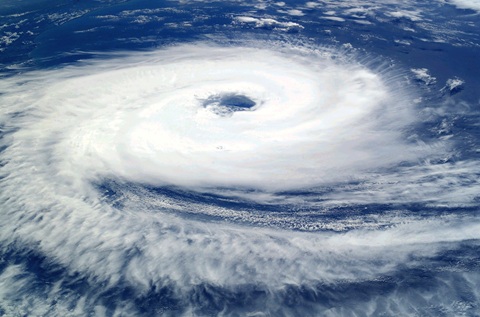 Visible satellite photograph of a hurricane with well-defined eyewall.